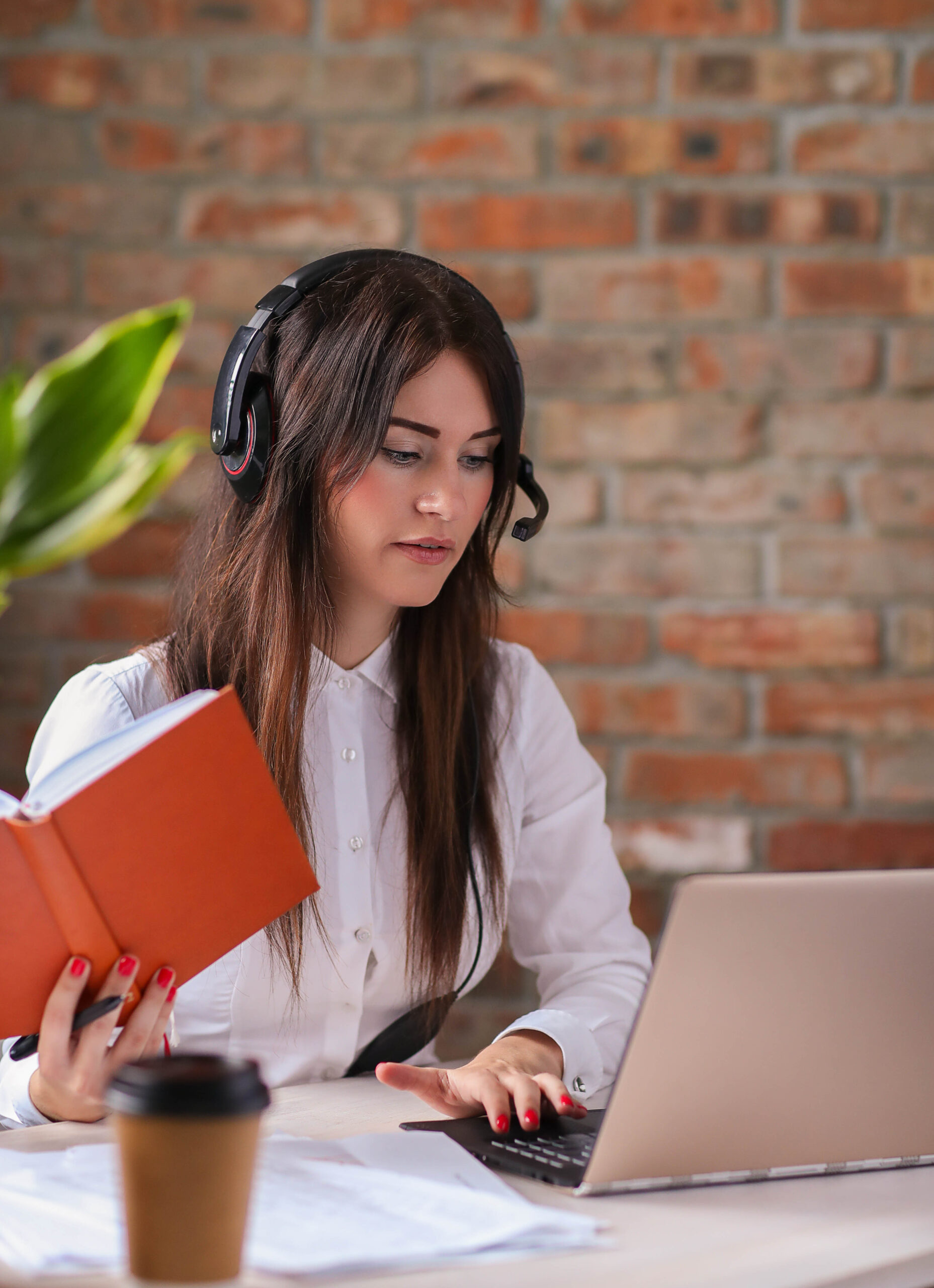 Woman working in call center as dispatcher